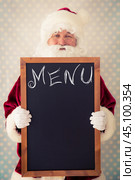 Santa Claus holding blackboard. Стоковое фото, фотограф yarruta / Фотобанк Лори