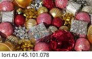 Christmas Ornaments Background Rotation, Spinning. Close up a Glitter Christmas Tree Decoration Items is Turning. Backdrop of New Year Ornate. Many Shiny Xmas Bauble, Balls and Bulbs. Top View, Frame. Стоковое видео, видеограф Марина Демидюк / Фотобанк Лори