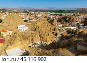 Aerial view of underground dwellings district and Moorish Castle in Guadix, Spain. Стоковое фото, фотограф Яков Филимонов / Фотобанк Лори