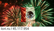 Mexican flag waving against a backdrop of green and red fireworks  celebrating Mexican Independence Day. Стоковое AI-изображение, AI-художник Anastacia Gaikova / Фотобанк Лори