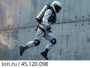 Astronaut running and jumping in futuristic protective gear. Стоковое AI-изображение, AI-художник Иван Рябоконь / Фотобанк Лори