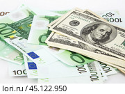 Доллары и евро на белом фоне. Крупный план.  money, euro and dollars on a white background. Стоковое фото, фотограф Лариса Гордеева / Фотобанк Лори