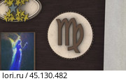 Camera moving closer to virgo wooden symbol. Стоковое видео, видеограф Данил Руденко / Фотобанк Лори