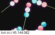 Colorful spherical marshmallows skewers rotating on black background. Стоковое видео, видеограф Данил Руденко / Фотобанк Лори