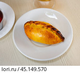 View of tasty empanada with cheese and jamon. Latin American traditional dish. Стоковое фото, фотограф Яков Филимонов / Фотобанк Лори