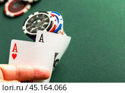 Cards and chips for poker on green table. Стоковое фото, фотограф Сергей Толмачёв / Фотобанк Лори
