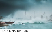 Sailboats struggling against stormy seas in the marina. Стоковое AI-видео, аниматор Юрий Поздников / Фотобанк Лори
