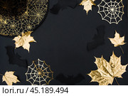 The inscription happy Halloween. Modern background with black bats, Golden leaves, cobwebs and wooden letters. Halloween with copy space for text. Flat lay, top. Стоковое фото, фотограф Photojuli / Фотобанк Лори