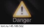 Flashing yellow warning triangle signaling potential hazards and risks. Стоковое видео, видеограф Данил Руденко / Фотобанк Лори
