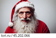 Santa Claus Tired, tortured, ugly, in red suit showing signs of exhaustion, candid capture of holiday fatigue, slump after delivering joy, seasonal weariness evident in posture. Стоковое AI-изображение, AI-художник Павел Муравьев / Фотобанк Лори