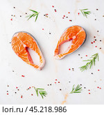 Food background, salmon steaks and seasonings. Стоковое фото, фотограф Natalia Gdovskaia / Фотобанк Лори