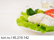 Steamed cod fish. Paleo, keto, fodmap healthy diet with vegetables. Стоковое фото, фотограф Natalia Gdovskaia / Фотобанк Лори