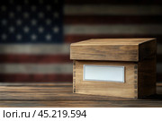 Vote bulletin and election box on the background of USA flag. Ballot paper for Democrats and Republicans. Elections, election campaign. Стоковое AI-изображение, AI-художник Ирина Михайличенко / Фотобанк Лори