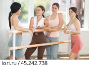 Young ballerinas communicate with each other during break between ballet rehearsals. Стоковое фото, фотограф Яков Филимонов / Фотобанк Лори