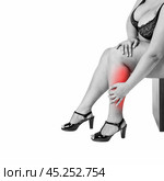 Leg pain, fat woman with muscle ache, overweight female body isolated on white background. Стоковое фото, фотограф Станислав Тарко / Фотобанк Лори