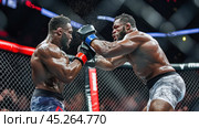Mma fighters exchanging powerful punches during intense match. Стоковое AI-изображение, AI-художник Юрий Поздников / Фотобанк Лори