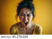 Screaming, hate, rage. Crying emotional angry asian woman screaming and yelling on gray studio background. Emotional, young face. Female close up portrait. Human emotions, facial expression concept. Стоковое AI-изображение, AI-художник Sergey Grishin / Фотобанк Лори