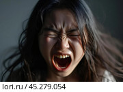 Portrait of angry emotional Asian girl screaming and frustrated shouting with anger, crazy and yelling on white background, Concept of attention deficit hyperactivity disorder (ADHD) Стоковое AI-изображение, AI-художник Sergey Grishin / Фотобанк Лори