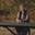 A woman with short hair plays an electronic piano outside in autumn in sunny weather. Стоковое видео, видеограф Неведицына Елена / Фотобанк Лори