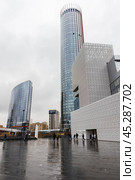 Yekaterinburg-City street view, people walk in front of Yeltsin Center. Редакционное фото, фотограф EugeneSergeev / Фотобанк Лори