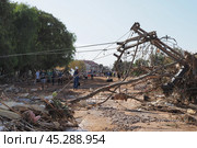 The aftermath of hurricane Dana in Valencia, Spain - Devastating consequences of flooding in Valencia, fallen power lines and debris. Стоковое фото, фотограф Данил Руденко / Фотобанк Лори