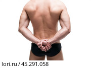 Handsome muscular bodybuilder posing on white background. Isolated studio shot. Стоковое фото, фотограф Станислав Тарко / Фотобанк Лори