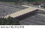 Aerial view on toll collection point on motorway. Стоковое видео, видеограф Михаил Коханчиков / Фотобанк Лори