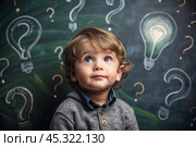 Development and education of children. A thoughtful boy on a dark background with a light bulb and question marks . Brainstorming and the concept of an idea. Стоковое AI-изображение, AI-художник Photojuli / Фотобанк Лори