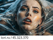 The girl is wrapped in cellophane or a bag. The girl is suffocating. Plastic pollution of the planet. Environmental hazard. Reducing the reuse of plastic. Recycling. The concept of garbage. Стоковое AI-изображение, AI-художник Photojuli / Фотобанк Лори
