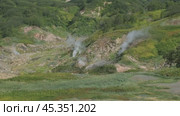 Hot springs and fumaroles in Valley of Geysers. Стоковое видео, видеограф Михаил Коханчиков / Фотобанк Лори
