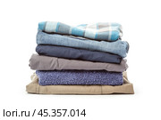 stack of clothing isolated on white. Стоковое фото, фотограф Сергей Толмачёв / Фотобанк Лори