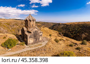 Aerial drone view of famous Vahramashen Church of the 11th century, located near destroyed Amberd fortress in sunny summer day. Cliff with Arkashian River deep in canyon. Aragatsotn region, Armenia. Стоковое фото, фотограф Алексей Ширманов / Фотобанк Лори