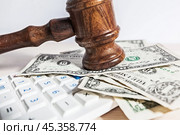 judge gavel and money on brown wooden table concept. Стоковое фото, фотограф Сергей Толмачёв / Фотобанк Лори