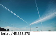 Chemtrail conspiracy theory. Long-lasting condensation trails left in sky by high-flying aircraft are actually chemtrails consisting of chemical or biological agents, sprayed for nefarious purposes. Стоковое AI-изображение, AI-художник Юлия Петровская / Фотобанк Лори