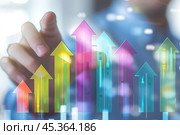 Increased profits. Benchmarking. Businessman analyzes profitability of working companies with digital augmented reality graphics, positive indicators, growing up graph and charts, colorful arrows. Стоковое AI-изображение, AI-художник Марина Демидюк / Фотобанк Лори