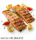 Two grilled salmon steaks with lemon and rosemary on white background. Стоковое AI-изображение, AI-художник Иван Рябоконь / Фотобанк Лори
