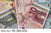 Video of euro paper banknotes. Euro bills of different denominations are scattered on the table. Money financial background. Flat lay, close-up, top view. Стоковое видео, видеограф Виктория Катьянова / Фотобанк Лори