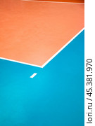 Crop photo of professional volleyball court with white lines, nobody. Orange volleyball courts in sport gym, sporty background. Team game success, healthy sporty lifestyle concept. Copy ad text space. Стоковое фото, фотограф Aleksandr Golubev / Фотобанк Лори