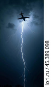 The aircraft encounters a severe thunderstorm, surrounded by dark clouds and illuminated by bright lightning strikes, highlighting the danger in the sky. Causes of air crashes. Generative AI. Стоковое AI-изображение, AI-художник Юлия Петровская / Фотобанк Лори
