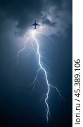 The aircraft encounters a severe thunderstorm, surrounded by dark clouds and illuminated by bright lightning strikes, highlighting the danger in the sky. Causes of air crashes. Generative AI. Стоковое AI-изображение, AI-художник Юлия Петровская / Фотобанк Лори