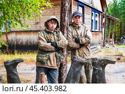 Молодые люди ( манси ), видимо братья , только что вернулись с рыбалки, и опрокинули на просушку свои сапоги ( типичный способ для здешних мест ). Их родовое имение находится в лесу ( недалеко от реки ). Они, коренные жители народов севера - манси, здесь живут годами. Основные продукты - самые, что ни на есть натуральные. Все остальное покупают раз в месяц, в городе. Сообщение с городом круглый год по реке , километров 20-25... (2011 год). Редакционное фото, фотограф Павел Просянов / Фотобанк Лори
