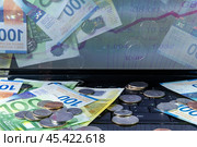 Money on the computer, franc, euro, cents. The concept of investment, exchange rate. Стоковое фото, фотограф Дмитрий Кобзев / Фотобанк Лори