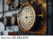 Old vintage pressure gauge showing pressure level in bar and psi units. Стоковое AI-изображение, AI-художник Иван Рябоконь / Фотобанк Лори