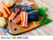 Salmon offal served with vegetables on board. Стоковое фото, фотограф Яков Филимонов / Фотобанк Лори