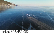 Wind blows snow over ice of Baikal. Стоковое видео, видеограф Михаил Коханчиков / Фотобанк Лори