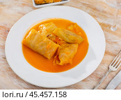 Golubtsy (cabbage rolls) served on table. Стоковое фото, фотограф Яков Филимонов / Фотобанк Лори