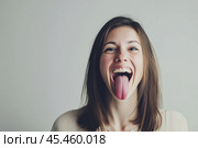 Woman stuck out her long tongue and showed it to us. Стоковое AI-изображение, AI-художник Дмитрий Киселёв / Фотобанк Лори