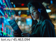 Female Investment Banker Wearing Headphones and Using a Tablet Computer with Financial Market Analytics Data. Team Leader Monitoring Daily Operations, Working of Behalf of Corporate Business Partners. Стоковое AI-изображение, AI-художник Sergey Grishin / Фотобанк Лори