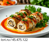 Chicken rolls with mushrooms and carrots, baked in sour cream and cheese sauce. An original appetizer will decorate any festive table. Enjoy your meal! Стоковое AI-изображение, AI-художник Сергей Елизарьев / Фотобанк Лори