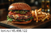 A close-up of a gourmet burger with all the fixings, served on a rustic wooden board with crispy fries on the side. Created by AI. Стоковое AI-изображение, AI-художник Ярославский Максим / Фотобанк Лори